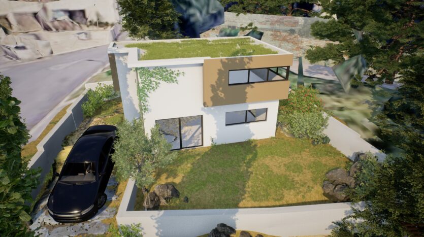 Maison moderne à deux étages avec toit végétalisé, jardin clos avec arbres et rochers, voiture noire stationnée.